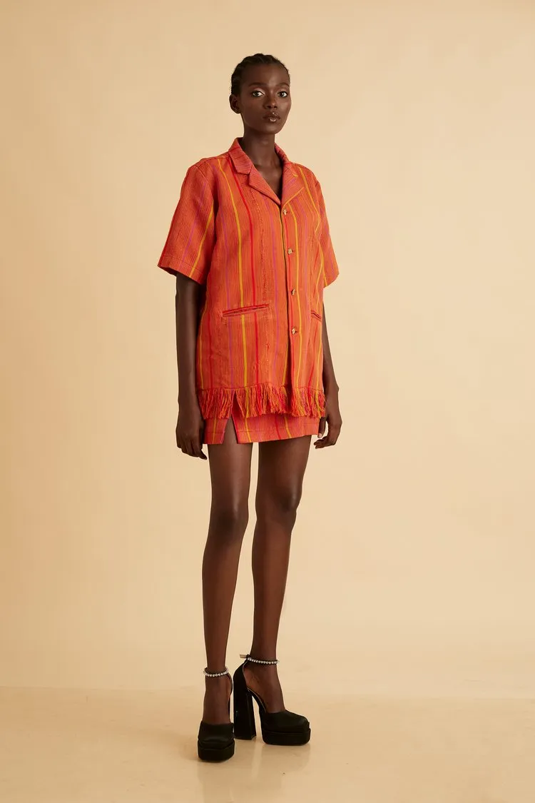 Jermaine Bleu shirt with hand-frayed hem and Brass buttons with High-waisted mini skirt with thigh slit detail LoLa Jo Set
